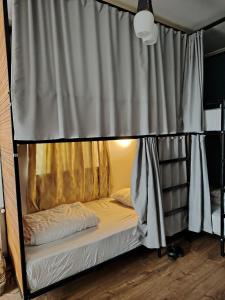 Ένα ή περισσότερα κρεβάτια σε δωμάτιο στο Palm Guesthouse