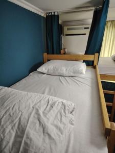 Ένα ή περισσότερα κρεβάτια σε δωμάτιο στο Palm Guesthouse