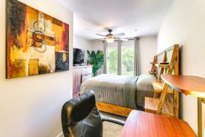 a bedroom with a bed and a desk and a table at Elevator In-Unit 3-Story Condo Only 14 Mi to DC! in Silver Spring