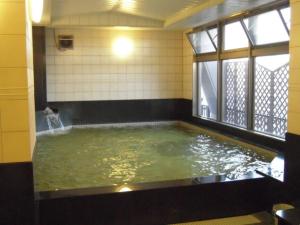 a large pool of water in a room at Midosuji Hotel - Vacation STAY 41579v in Osaka