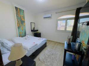 Voodi või voodid majutusasutuse Phoenix Pyramids View Inn toas