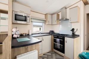 Η κουζίνα ή μικρή κουζίνα στο Maple - Near Folly Farm Cosy Retreat +15 φωτογραφίες