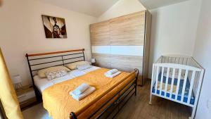 Postel nebo postele na pokoji v ubytování Apartments Aurora