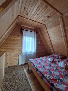 Postel nebo postele na pokoji v ubytování Brvnara Čigota