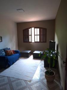 Un pat sau paturi într-o cameră la Casa Flor 2- Centro vista p o Rio +5 fotografii