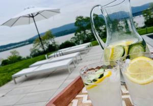 a drink in a pitcher and a glass of water at Hudson House in Newburgh