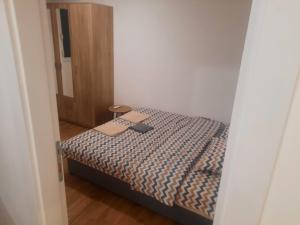 Postel nebo postele na pokoji v ubytování Zmaj lux