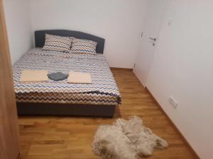 Postel nebo postele na pokoji v ubytování Zmaj lux