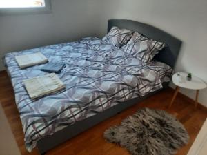 Postel nebo postele na pokoji v ubytování Zmaj lux