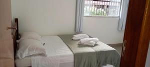 Postel nebo postele na pokoji v ubytování aeroporto e praia loft espaçoso