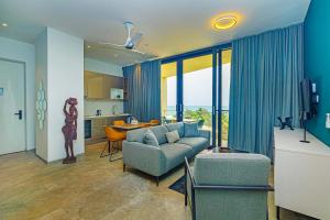 a living room with a couch and a table at The Edge in Bijilo