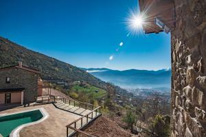 a villa with a view of the mountains at The View Village - Villas Suites & Spa in Karpenisi