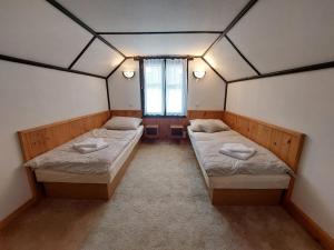 Postel nebo postele na pokoji v ubytování ZÁTOKA Živohošť - Apartmány