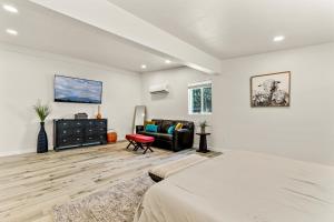 a bedroom with a bed and a couch at Jupiter Drive in Anchorage