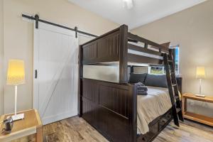 a bedroom with a bunk bed and a closet at Jupiter Drive in Anchorage