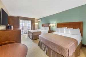 Postel nebo postele na pokoji v ubytování Best Western Plus Atrium Inn