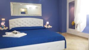 Postel nebo postele na pokoji v ubytování Antico Casale B&B