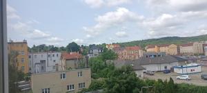 a view of a city with buildings and cars at Apartament Asmodeusz in Strzegom
