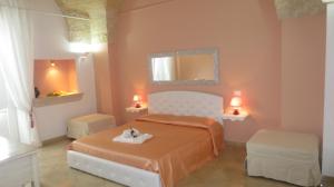 Postel nebo postele na pokoji v ubytování Antico Casale B&B