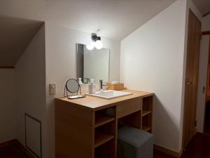 a bathroom with a sink and a mirror at Asu base Yuge in Hachimantai +70 photos