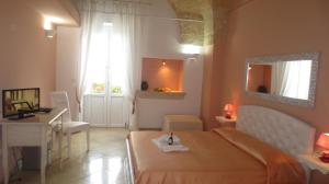 Postel nebo postele na pokoji v ubytování Antico Casale B&B