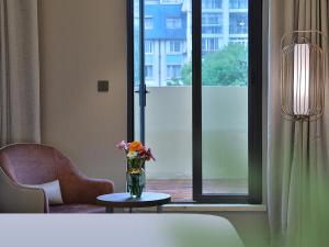 Rúm í herbergi á Crystal Orange Hotel Shanghai Hongqiao Jinhui Road