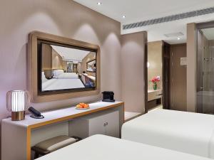 Rúm í herbergi á Crystal Orange Hotel Shanghai Hongqiao Jinhui Road +32 myndir