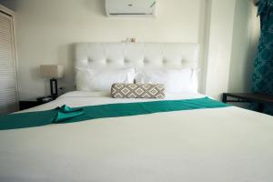 Postel nebo postele na pokoji v ubytování Match Resort