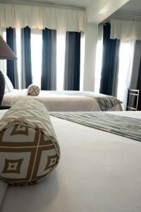 Postel nebo postele na pokoji v ubytování Match Resort