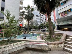 a swimming pool in the middle of a city at B&B - Private rooms 3 in Tirana