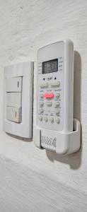 a small appliance is attached to a wall at La NIÑA 6 in Jesús María