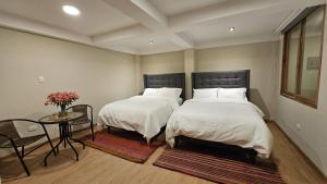 A bed or beds in a room at Amaru TreeHouse