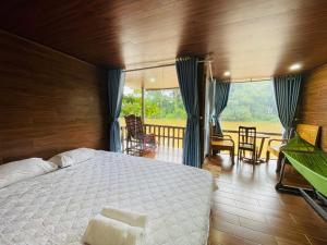 Postel nebo postele na pokoji v ubytování Green Bamboo Lodge Resort + 37 fotografií