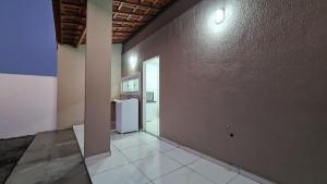 an empty room with a refrigerator in a building at Casa 60 Completa Garagem 2ACs WIFI Juazeiro, Crato, Barbalha in Barbalha