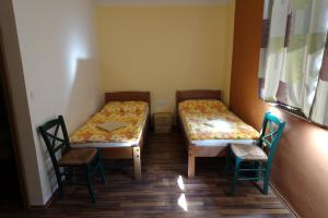 Postel nebo postele na pokoji v ubytování Penzion u Tomčalů