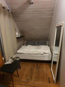 Postel nebo postele na pokoji v ubytování Bergvegur 7