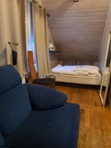 Postel nebo postele na pokoji v ubytování Bergvegur 7