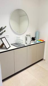 a white counter with a mirror on top of it at Villa Mirko in Barbariga +76 photos