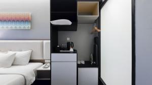Kuchyň nebo kuchyňský kout v ubytování Fives Hotel DNP