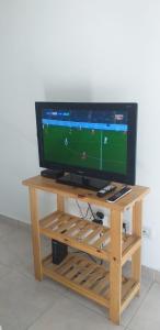 a tv sitting on top of a wooden table at Las Piedras in Pilar