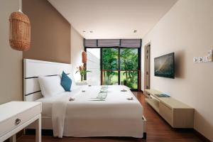 Кровать или кровати в номере Laguna Parkside Lăng Cô +35 фотографий