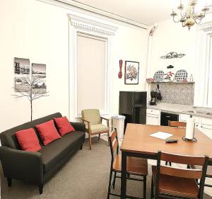a living room with a couch and a table at Suite 3 Eighteen in Shelbyville