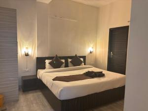 Postel nebo postele na pokoji v ubytování Ritz The Boutique Hotel