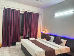 Postel nebo postele na pokoji v ubytování Ritz The Boutique Hotel