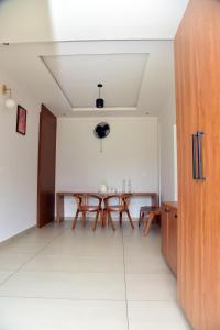a dining room with a table in a room at Snow white resort wayanad in Wayanad