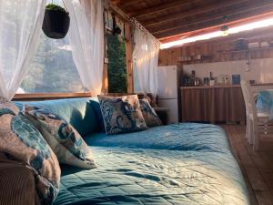a bed in a room with a window at Каравана Макси in Chernomorets
