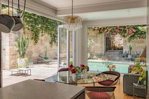 a living room with a glass table and a pool at The Darling Private Oasis with Heated Magnesium Pool in Sydney