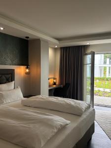 Postel nebo postele na pokoji v ubytování Villaggio Hotel