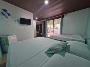Postel nebo postele na pokoji v ubytování Hotel Carlota Tamarindo