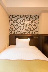 Postel nebo postele na pokoji v ubytování Shinagawa Tobu Hotel